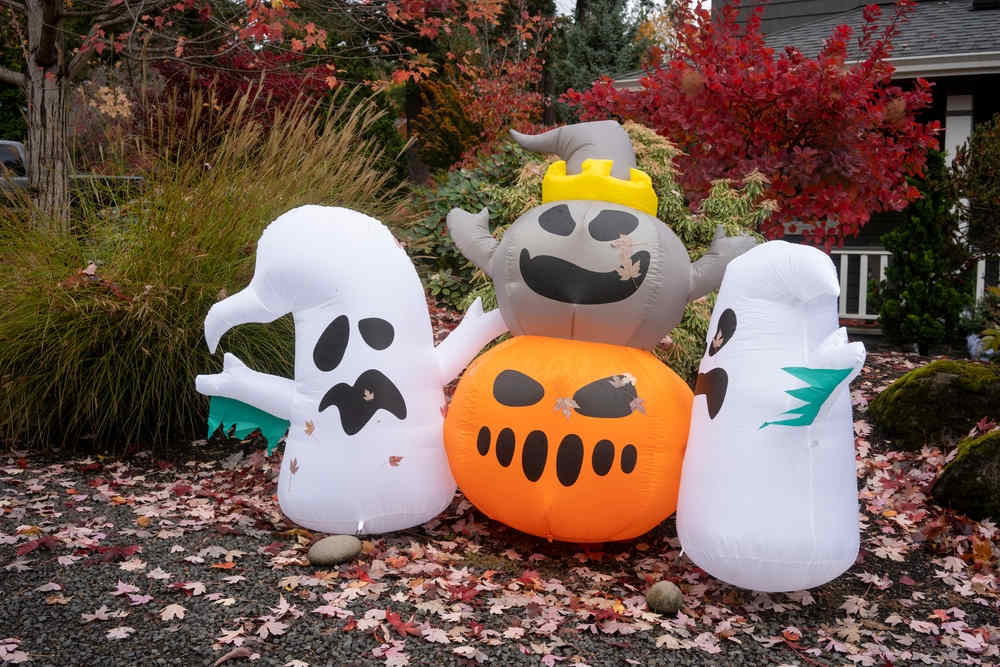 Several Halloween inflatable decorations in the courtyard.